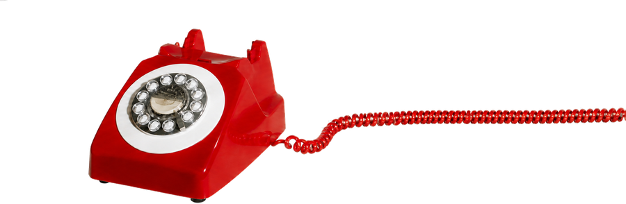 Red vintage telephone with its coiled cable